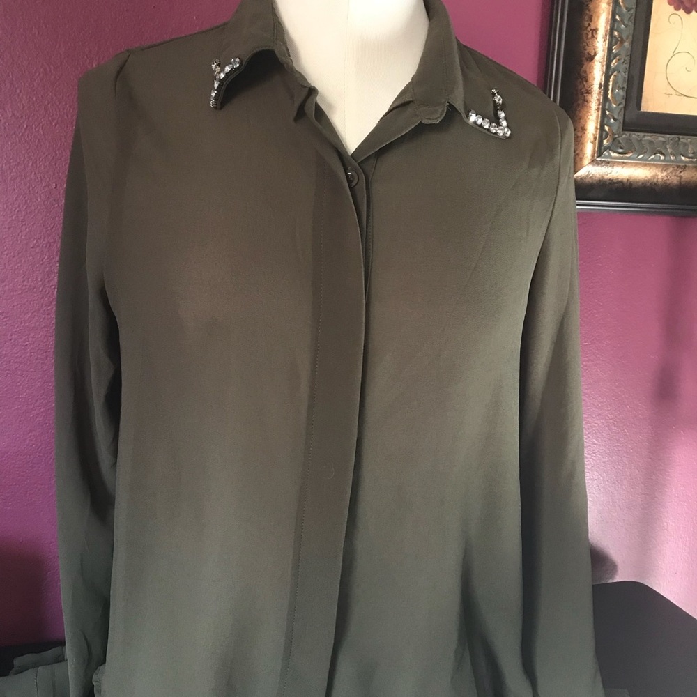 Olive green silk blouse.